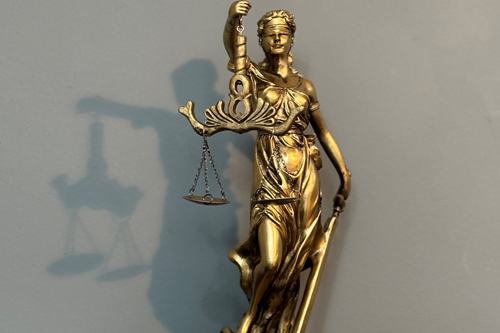 Statue of Lady Justice in the offices of Mulgrave Law, Immigration Lawyers in London.